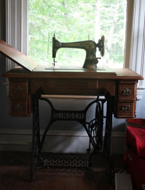 Singer treadle sewing machine and table in vacation bedroom