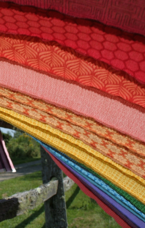 rainbow jellyroll quilt top