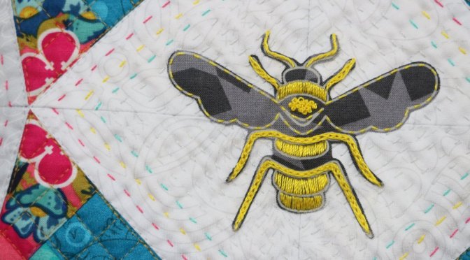 applique embroidered bee from alison glass fabric constant flux detail